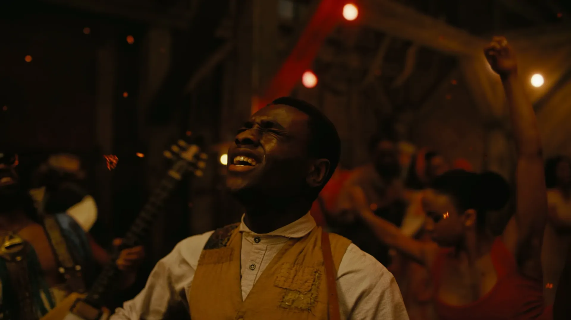 Sammie singing, ecstatic, juke joint closeup.